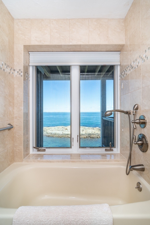 22 Oceanside Drive, Unit 22 Hull, MA 02045 - Photo 25 of 37 a bathroom with a sink and a bathtub