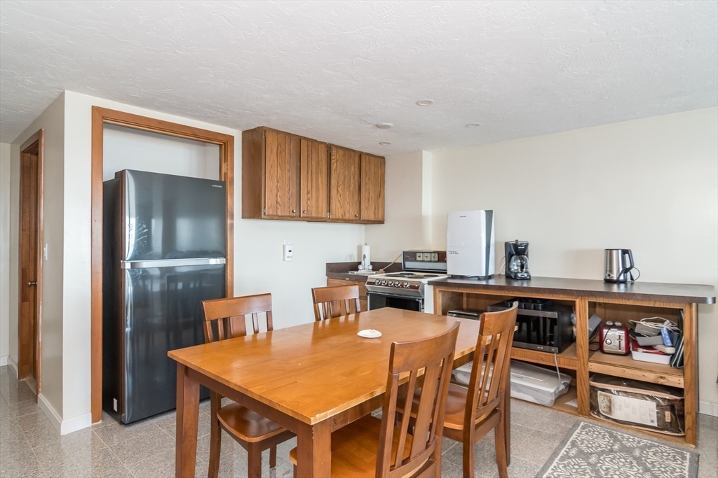 22 Oceanside Drive, Unit 22 Hull, MA 02045 - Photo 30 of 37 a view of a dining room with furniture