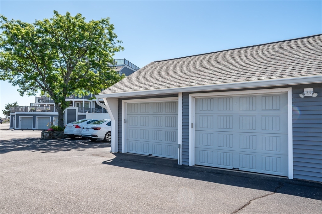 22 Oceanside Drive, Unit 22 Hull, MA 02045 - Photo 36 of 37 a house with a outdoor space