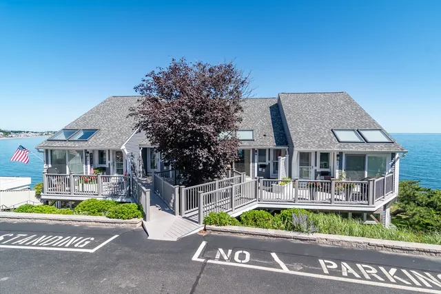 a front view of house with a garden