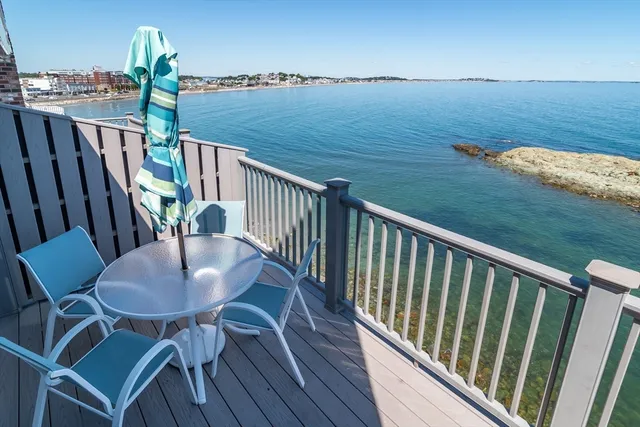 a view of a balcony with furniture