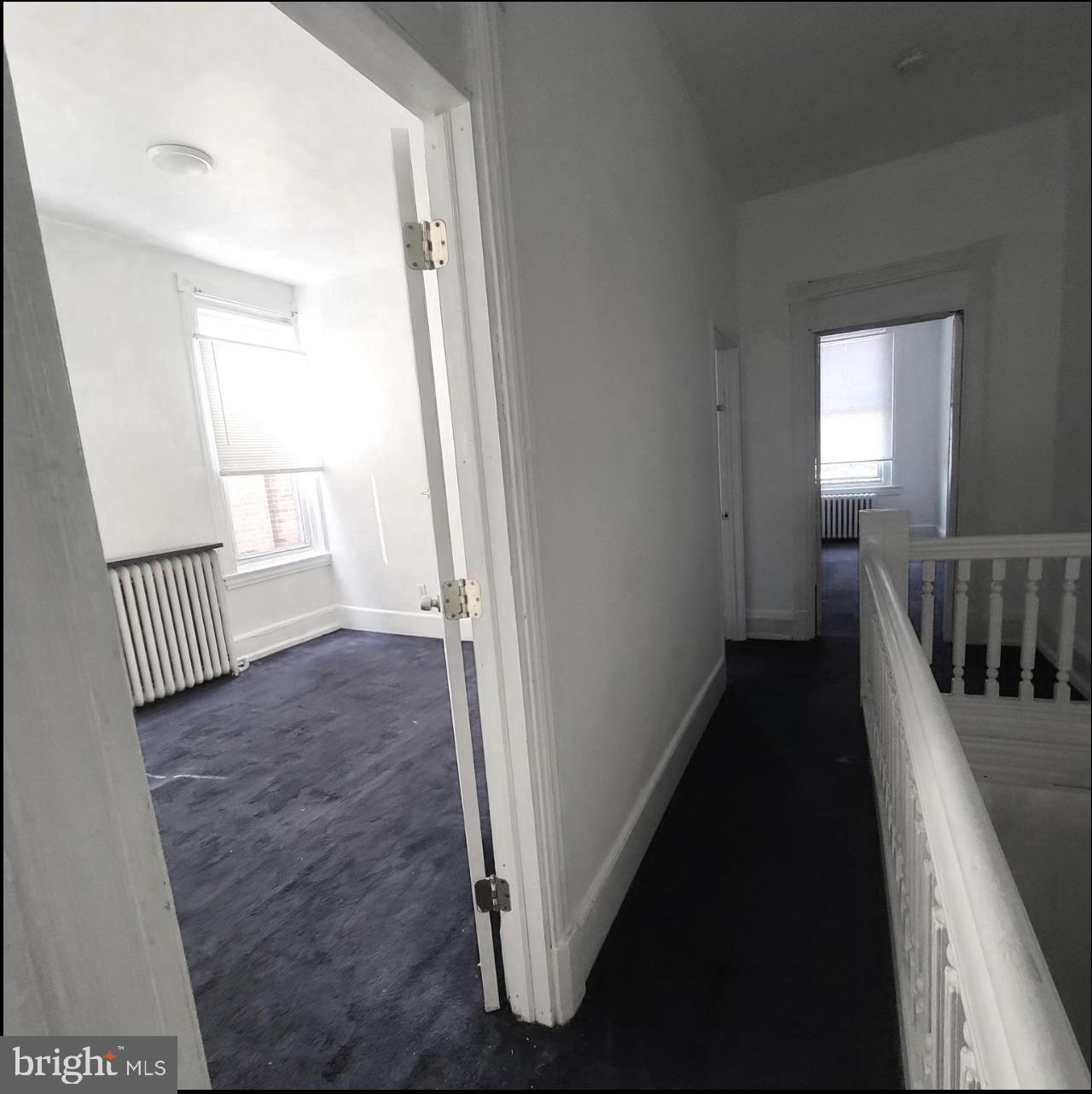 433 North 33rd Street Philadelphia, PA 19104 - Photo 18 of 27 a view of a hallway to a livingroom with wooden floor and stairs