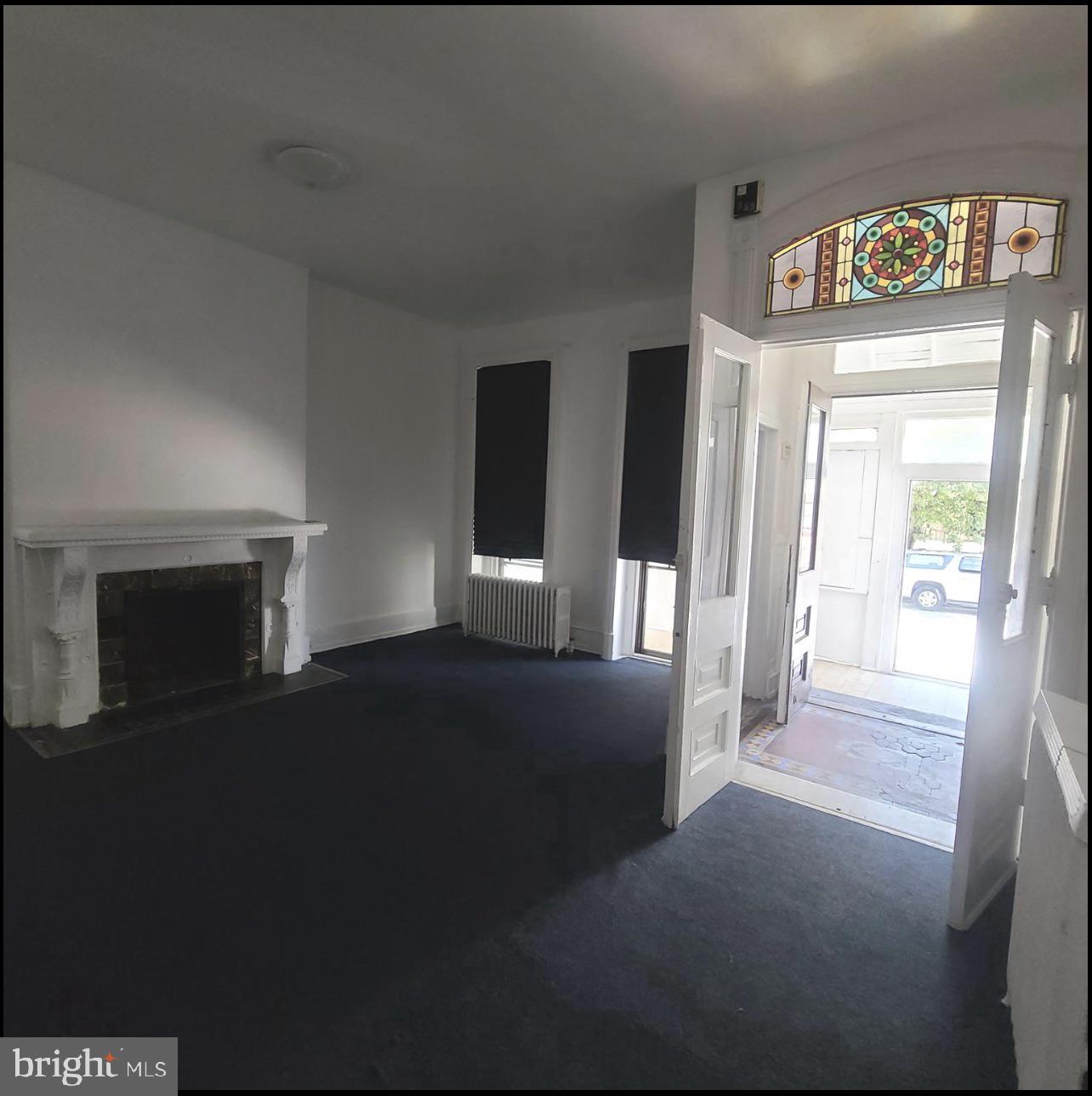 433 North 33rd Street Philadelphia, PA 19104 - Photo 6 of 27 a view of a hallway with wooden floor and fireplace