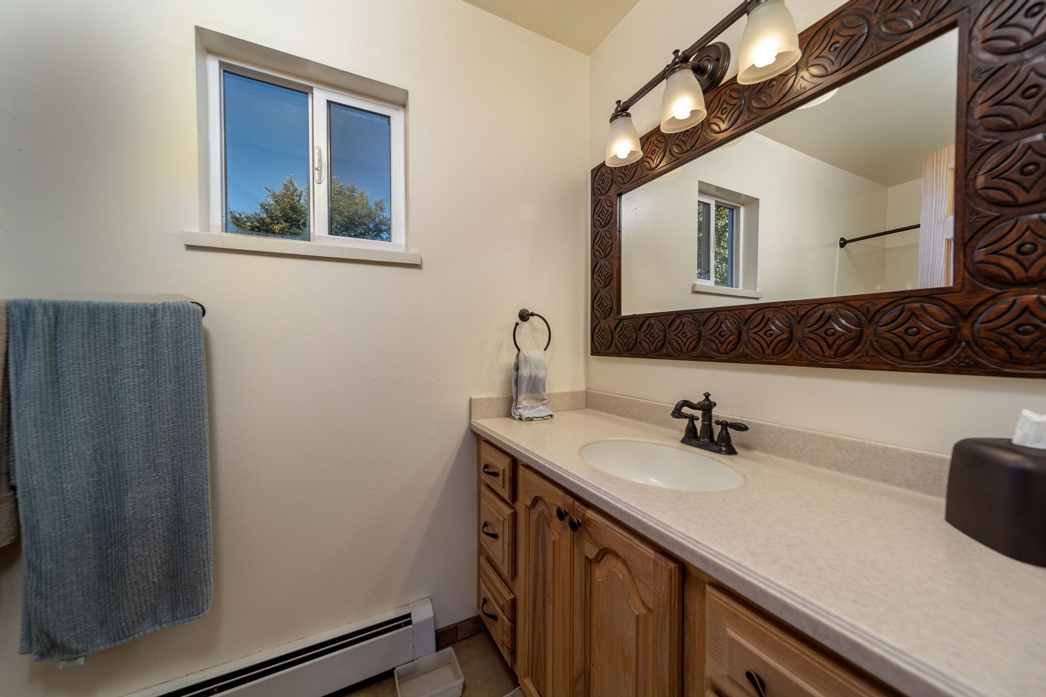 2034 J Road Fruita, CO 81521 - Photo 19 of 38 a bathroom with a sink and a mirror