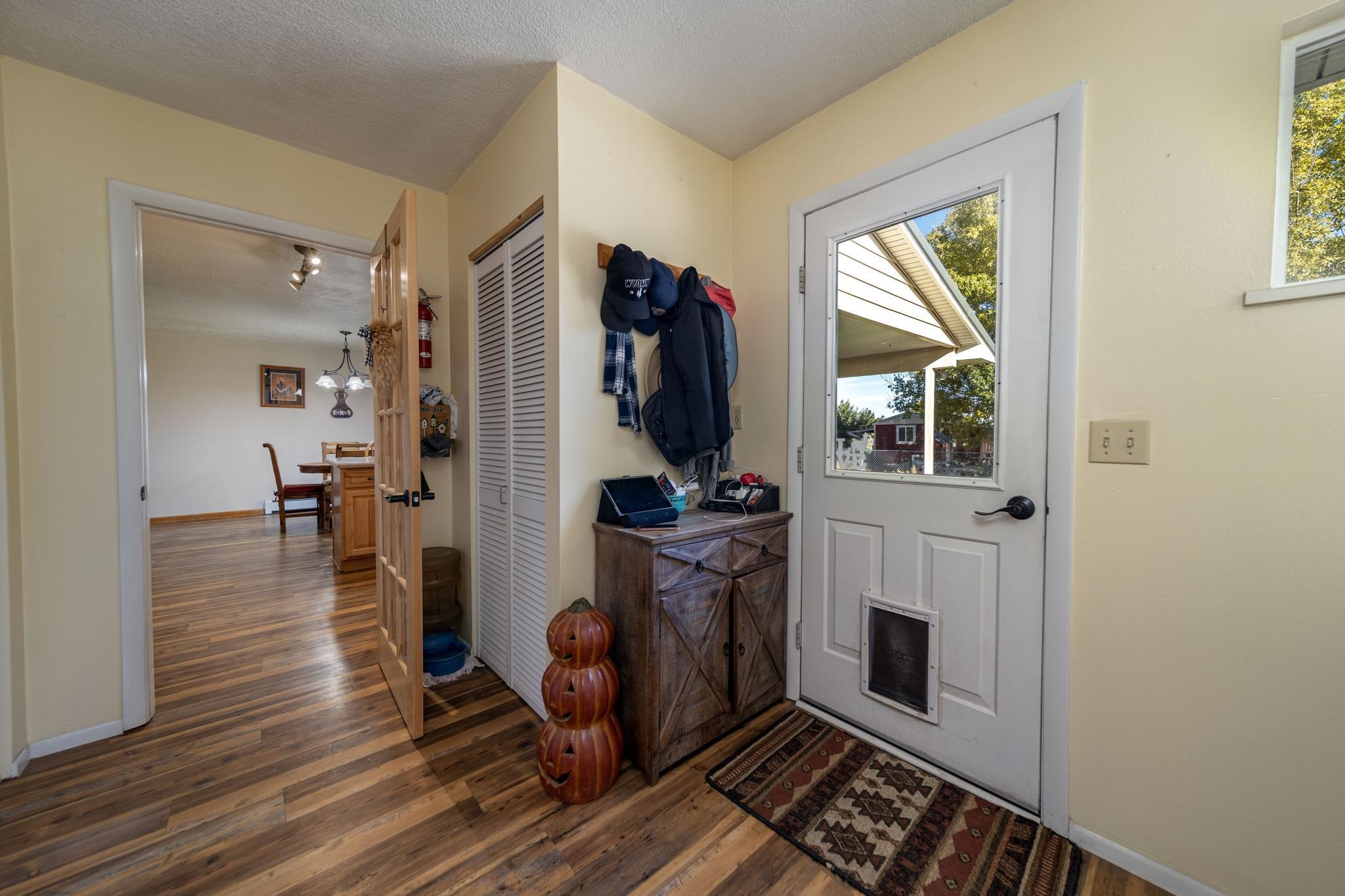 2034 J Road Fruita, CO 81521 - Photo 2 of 38 a living room with furniture a fireplace and a window