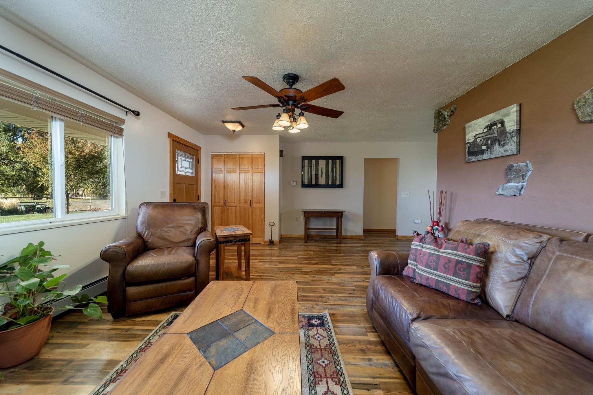 2034 J Road Fruita, CO 81521 - Photo 3 of 38 a living room with furniture and a large window