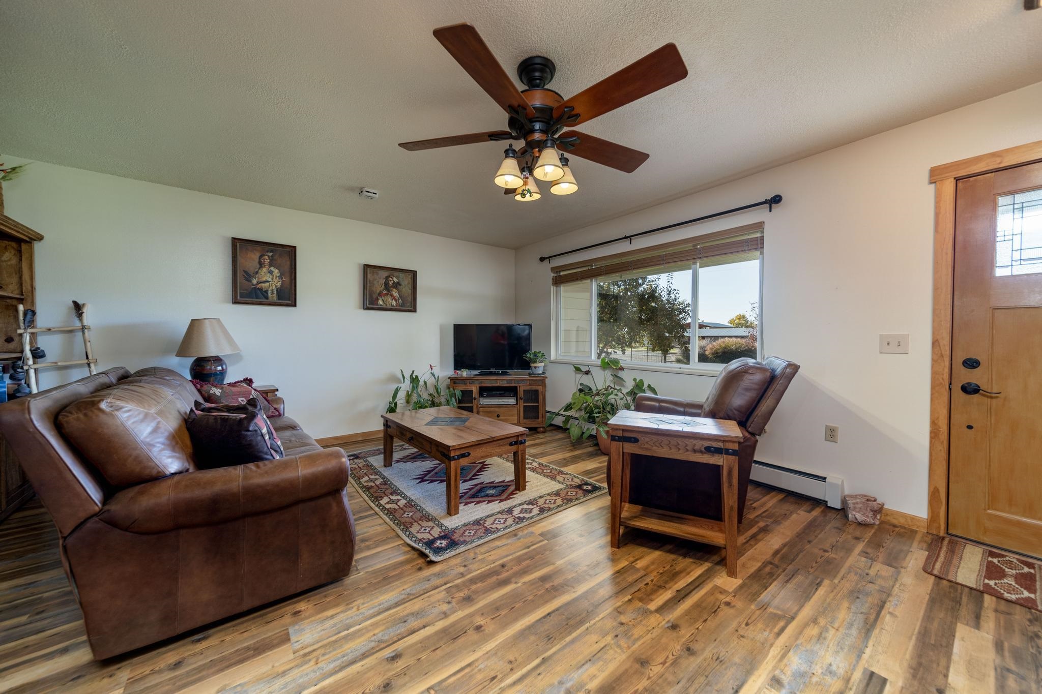 2034 J Road Fruita, CO 81521 - Photo 4 of 38 a living room with furniture and a large window