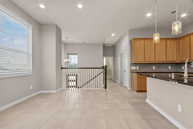 a view of kitchen with cabinets and outdoor space