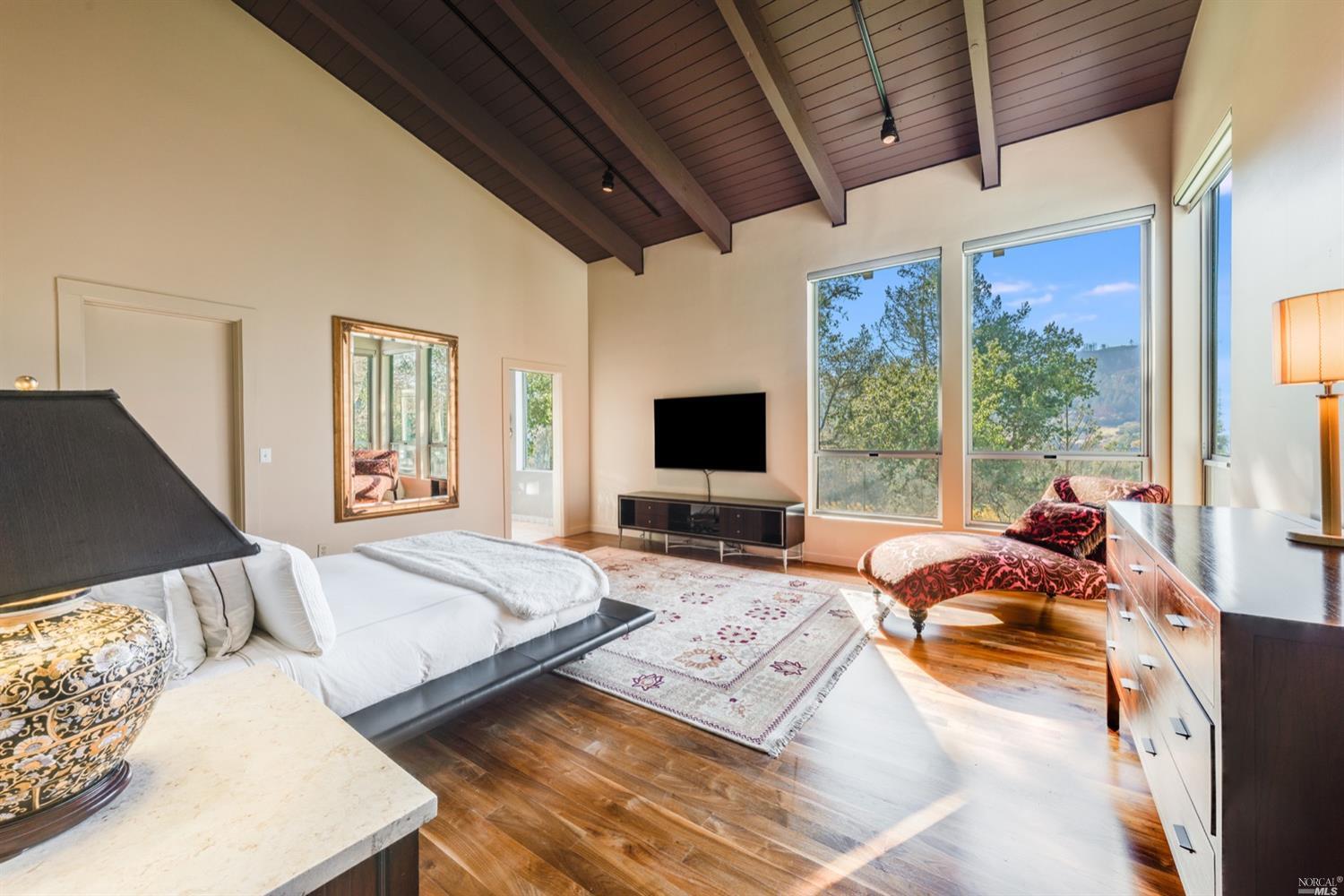 9 Bournemouth Road St. Helena, CA 94574 - Photo 13 of 40 a bedroom with furniture and large windows