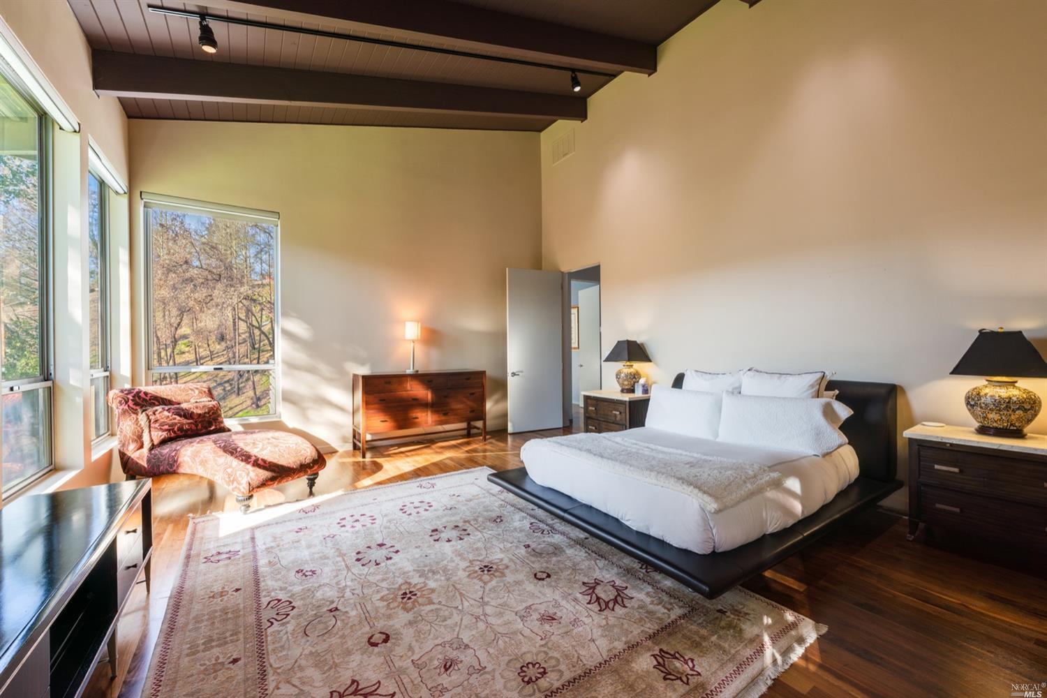 9 Bournemouth Road St. Helena, CA 94574 - Photo 15 of 40 a bedroom with a bed and wooden floor