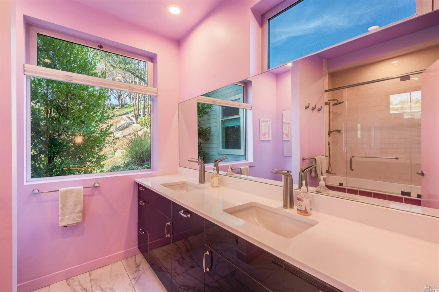 9 Bournemouth Road St. Helena, CA 94574 - Photo 18 of 40 a bathroom with a double vanity sink window and a large mirror