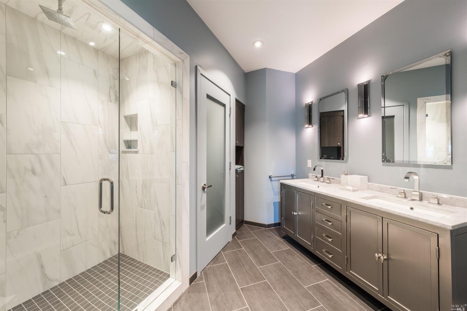 9 Bournemouth Road St. Helena, CA 94574 - Photo 24 of 40 a bathroom with a double vanity sink mirror and shower