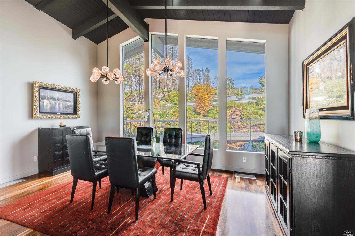9 Bournemouth Road St. Helena, CA 94574 - Photo 7 of 40 a view of a dining room with furniture a chandelier and wooden floor