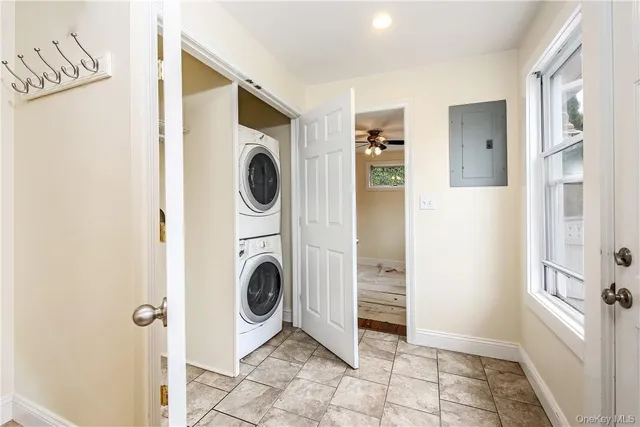 a view of a hallway with washer and dryer