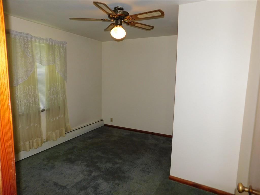 104 Memory Lane Apollo, PA 15613 - Photo 13 of 18 an empty room with windows and fan