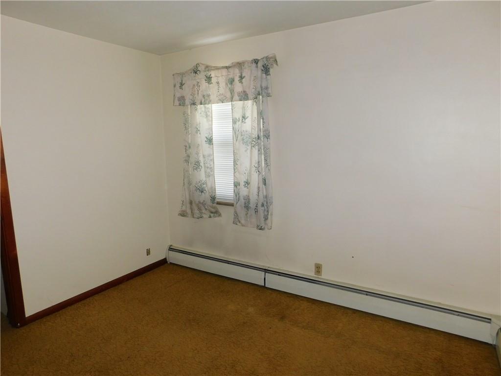 104 Memory Lane Apollo, PA 15613 - Photo 14 of 18 a view of a small space with wooden floor and a window