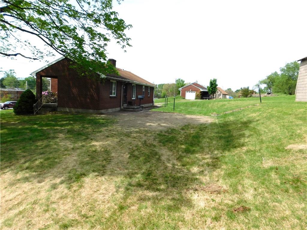 104 Memory Lane Apollo, PA 15613 - Photo 4 of 18 a house view with a garden space