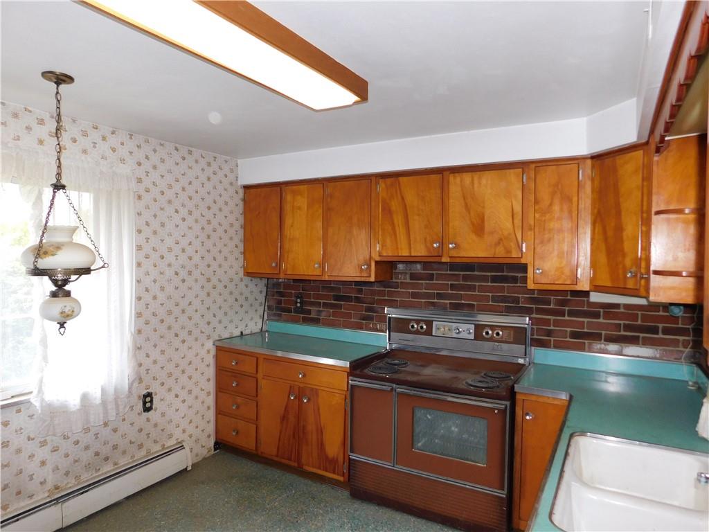 104 Memory Lane Apollo, PA 15613 - Photo 8 of 18 a kitchen with stainless steel appliances granite countertop a stove a sink and a microwave