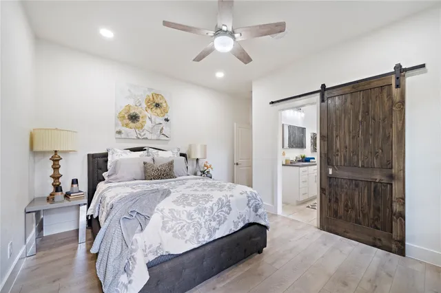 a bedroom with a bed and a dresser