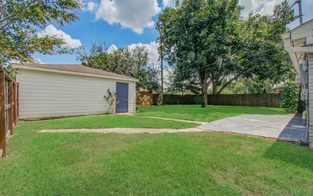 a view of a backyard with a garden