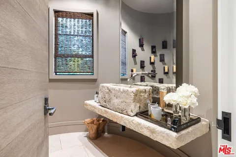 a room with wooden floor and outdoor seating