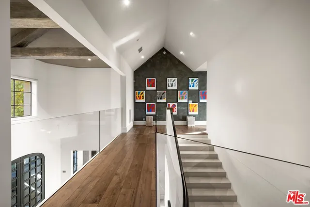 a large bathroom with a large tub and sink