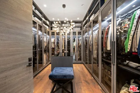 a spacious bedroom with a bed and a large window