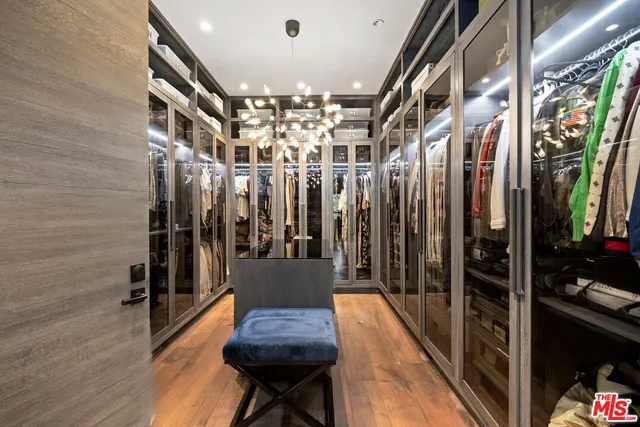 a spacious bedroom with a bed and a large window