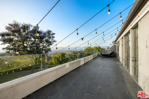 a living room with furniture window and a wooden floor