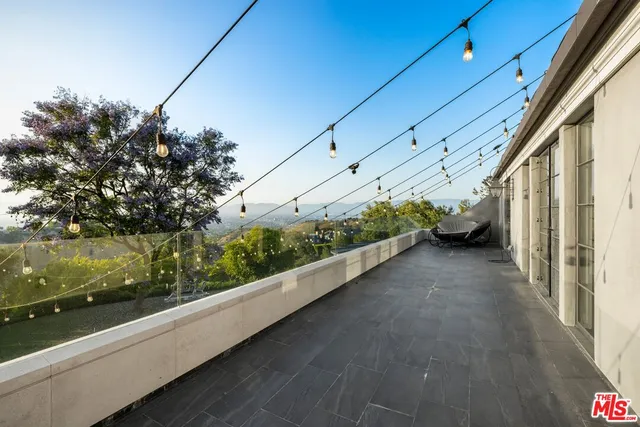 a living room with furniture window and a wooden floor