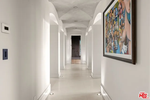 a view of a patio with couches table and chairs and potted plants