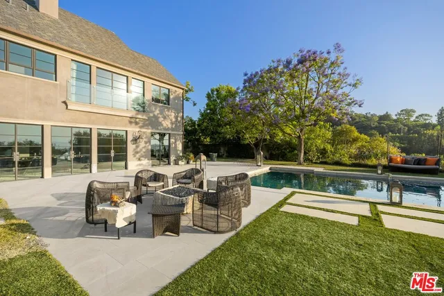 a kitchen with stainless steel appliances granite countertop a stove and a trees