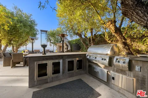 a view of mountain with sunset in background
