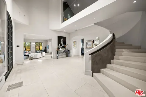 a living room with fireplace furniture and a flat screen tv