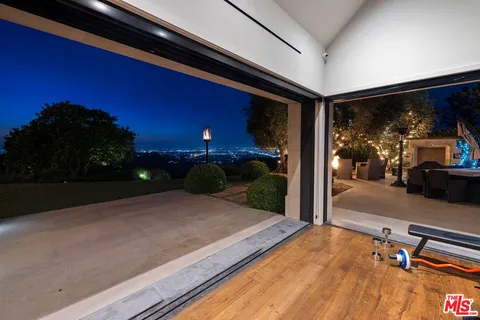 a view of a garden with lawn chairs