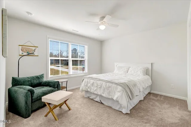 a view of a terrace with furniture and city view