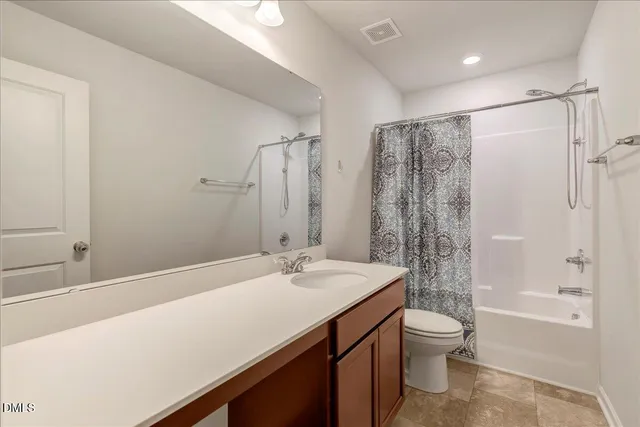 a view of a white house with a swimming pool