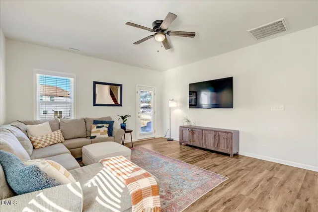 a spacious bedroom with a bed and a window