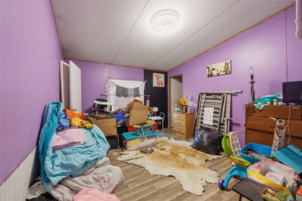 2449 East Fm 120 Denison, TX 75021 - Photo 26 of 30 a bed room with a bed and a couch
