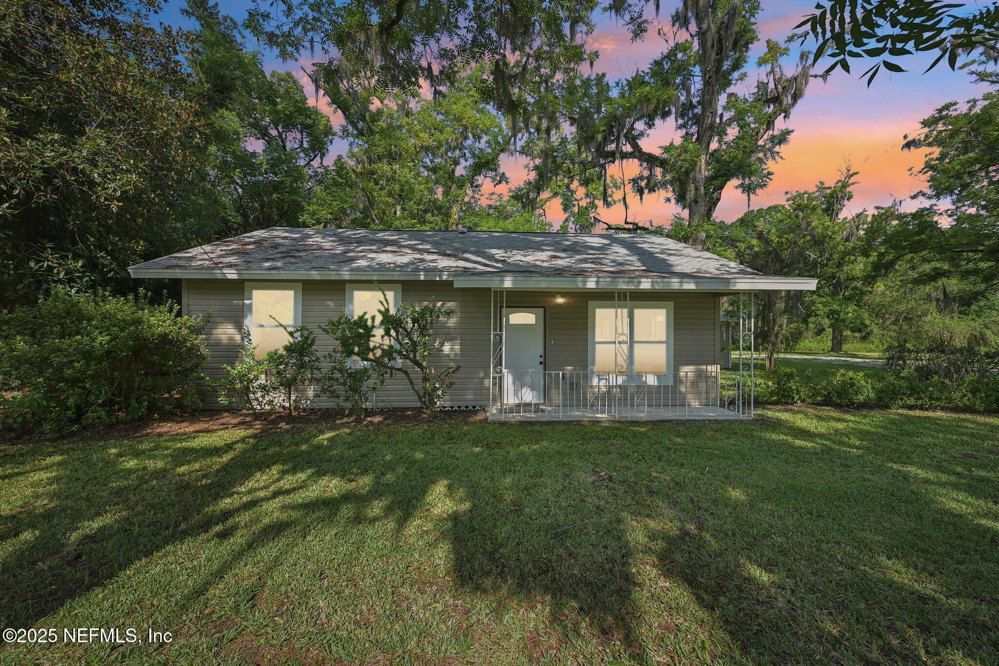 1217 Colley Road Starke, FL 32091 - Photo 1 of 42 a front view of a house with a garden