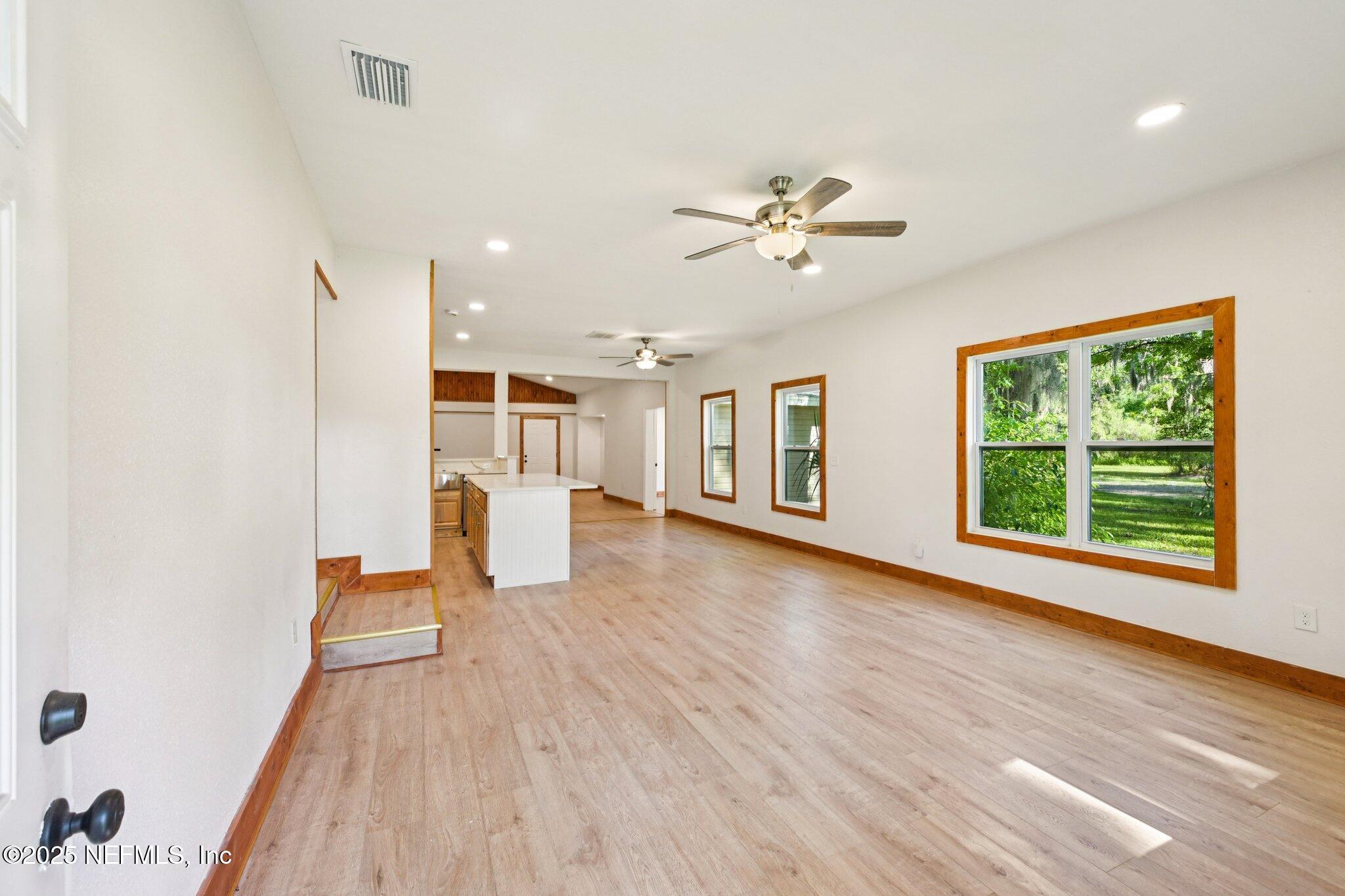 1217 Colley Road Starke, FL 32091 - Photo 41 of 42 a view of a room with a wooden floor and ceiling fan