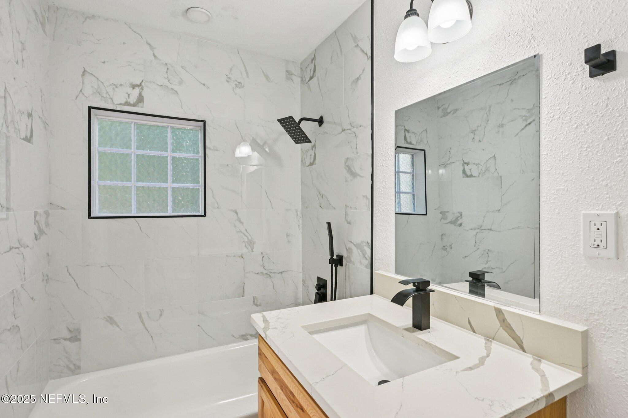 1217 Colley Road Starke, FL 32091 - Photo 20 of 42 a bathroom with a sink and a mirror