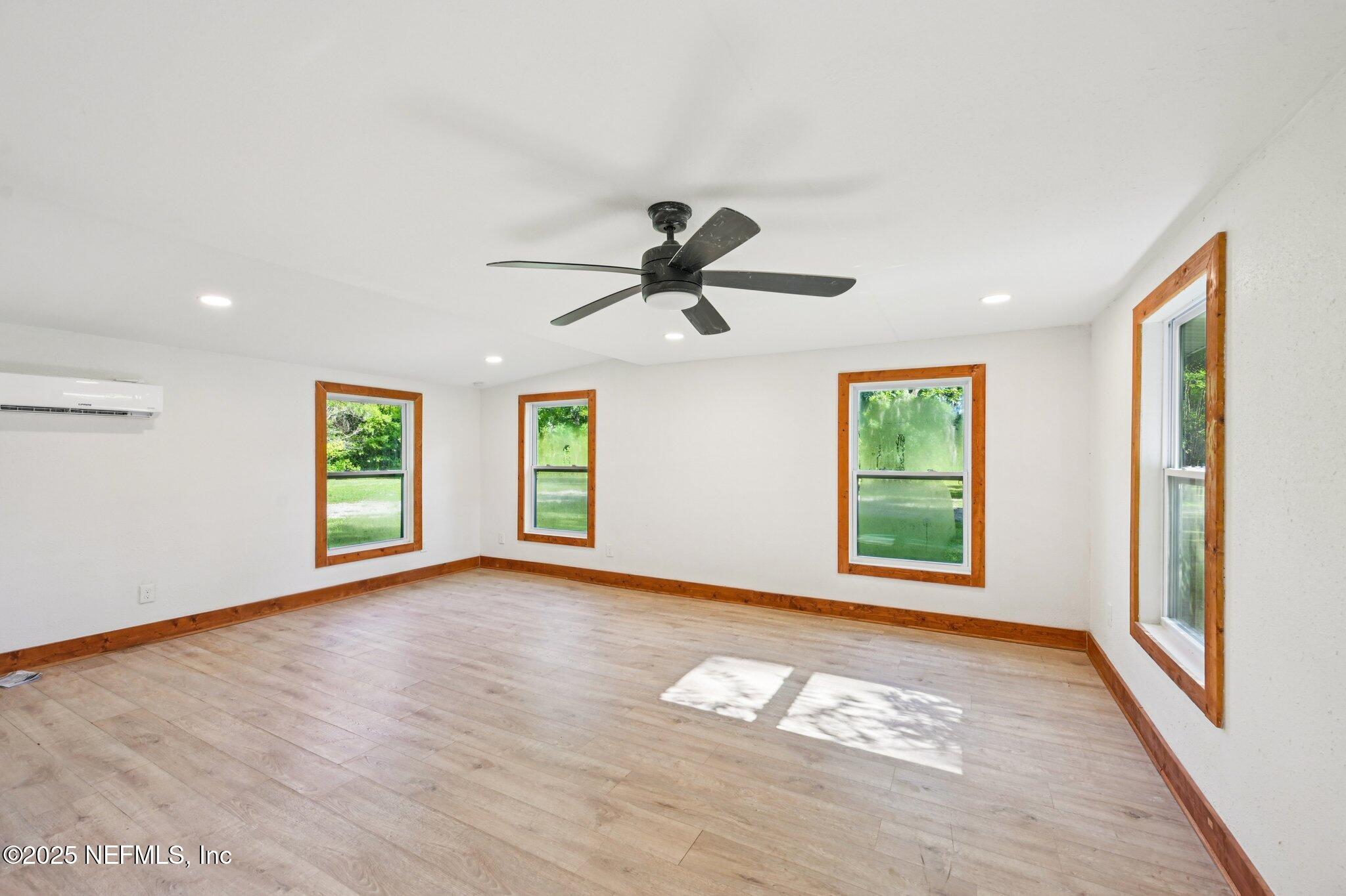 1217 Colley Road Starke, FL 32091 - Photo 26 of 42 a view of empty room with wooden floor and fan