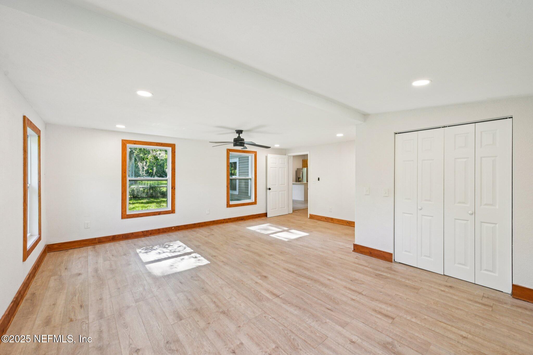 1217 Colley Road Starke, FL 32091 - Photo 27 of 42 a view of empty room with wooden floor and fan