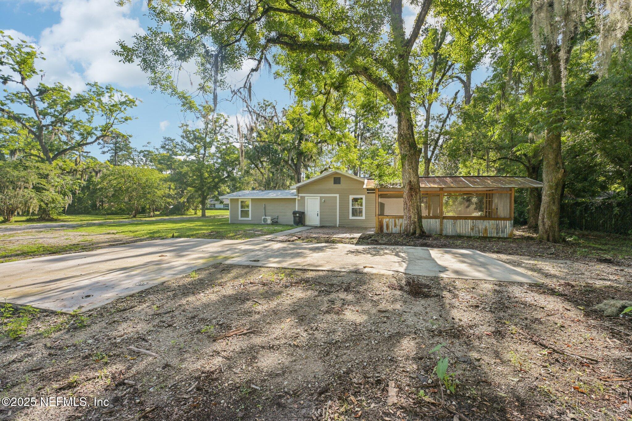 1217 Colley Road Starke, FL 32091 - Photo 34 of 42 a view of house with backyard and tree