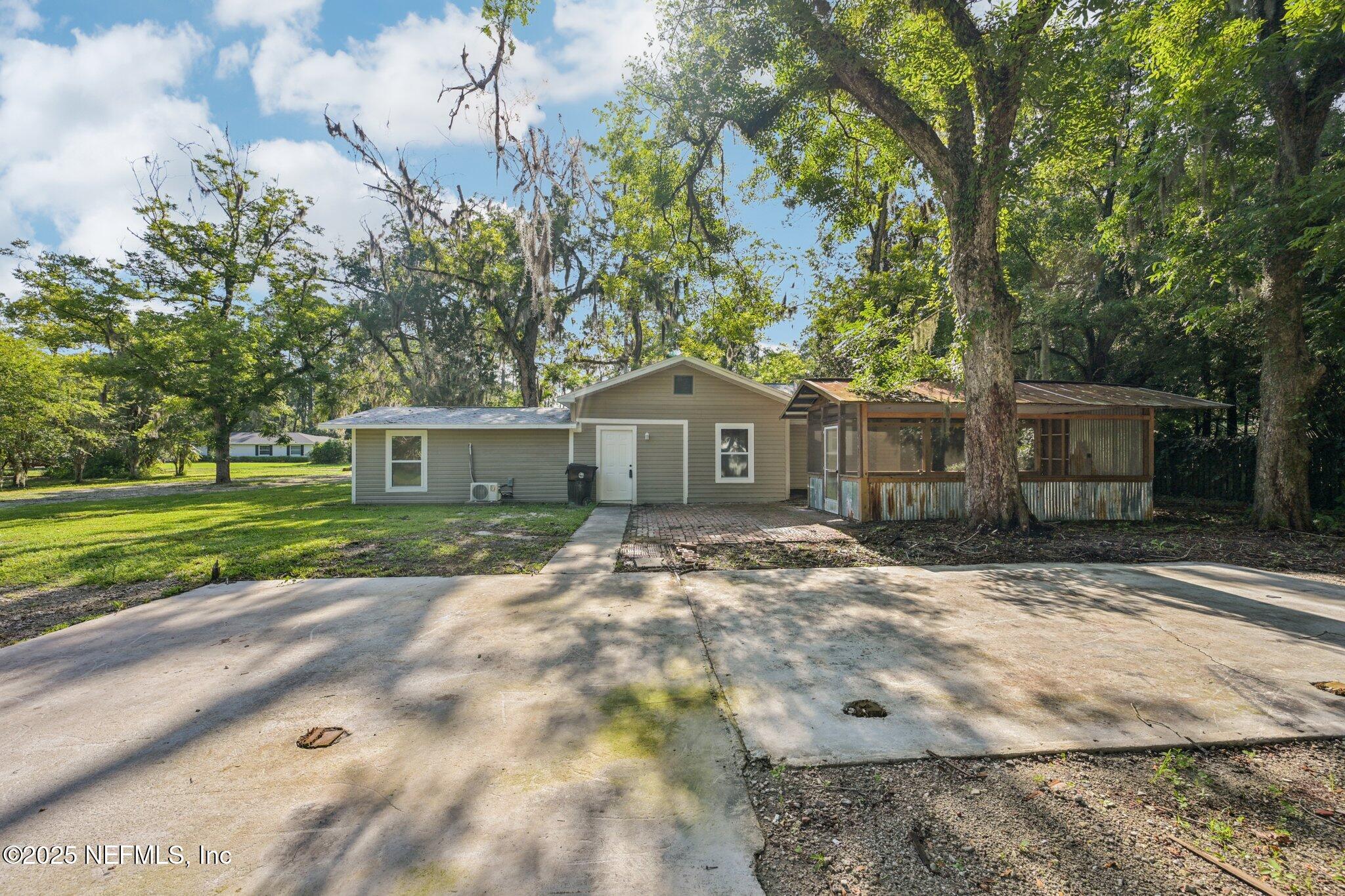 1217 Colley Road Starke, FL 32091 - Photo 35 of 42 a front view of a house with a yard