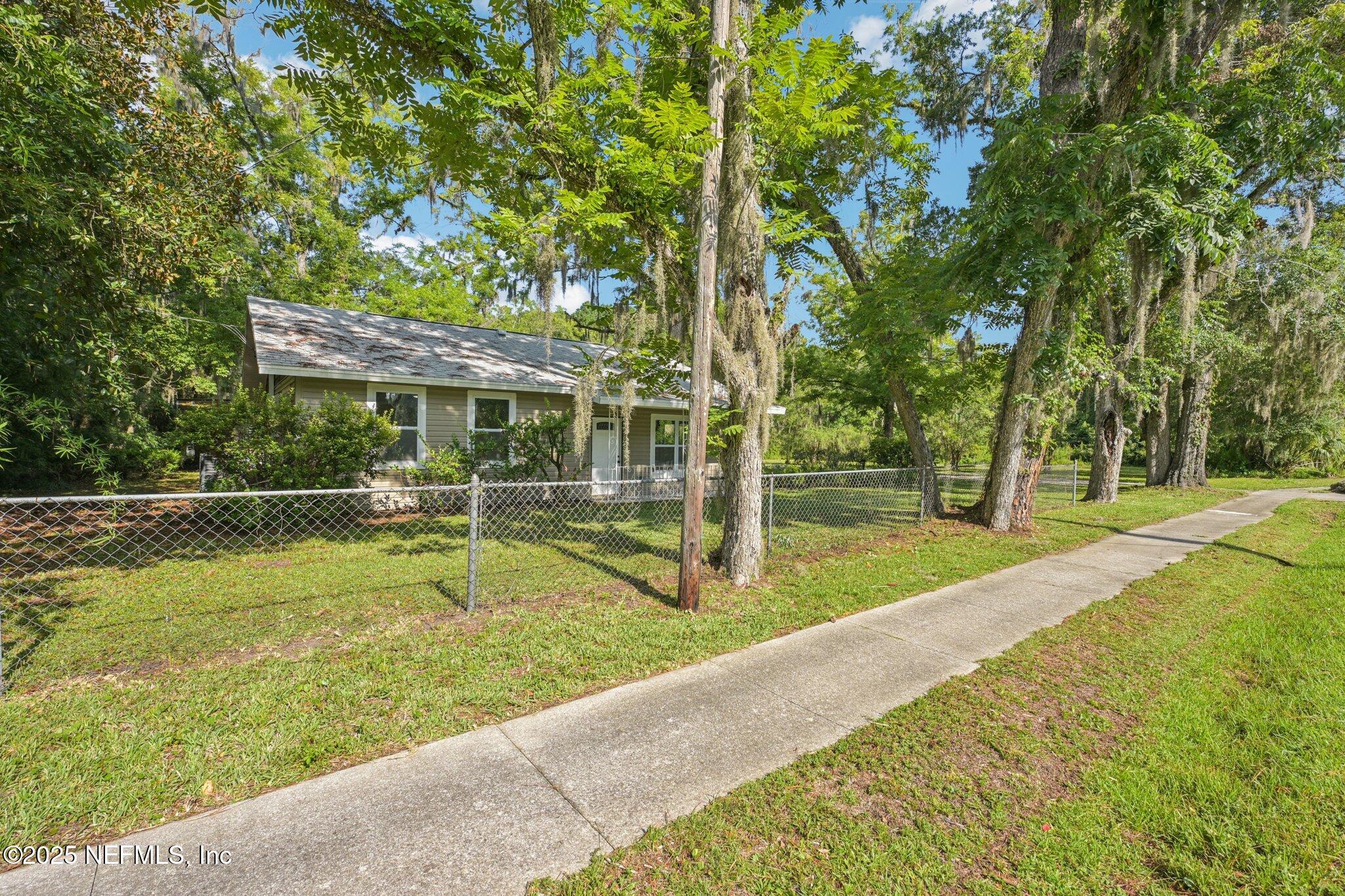 1217 Colley Road Starke, FL 32091 - Photo 4 of 42 a view of house with swimming pool and a yard