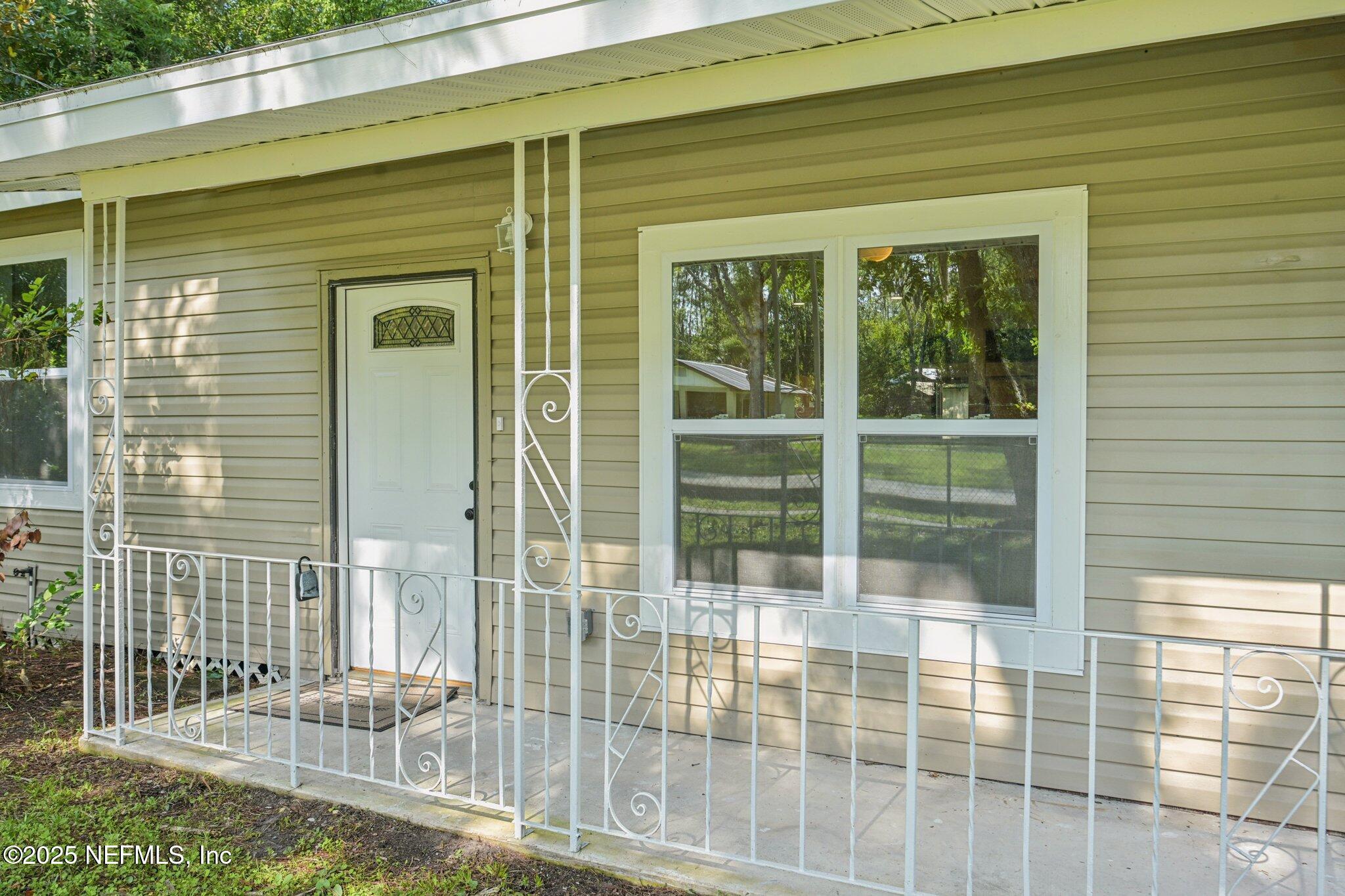 1217 Colley Road Starke, FL 32091 - Photo 5 of 42 a view of a porch with a floor to ceiling window