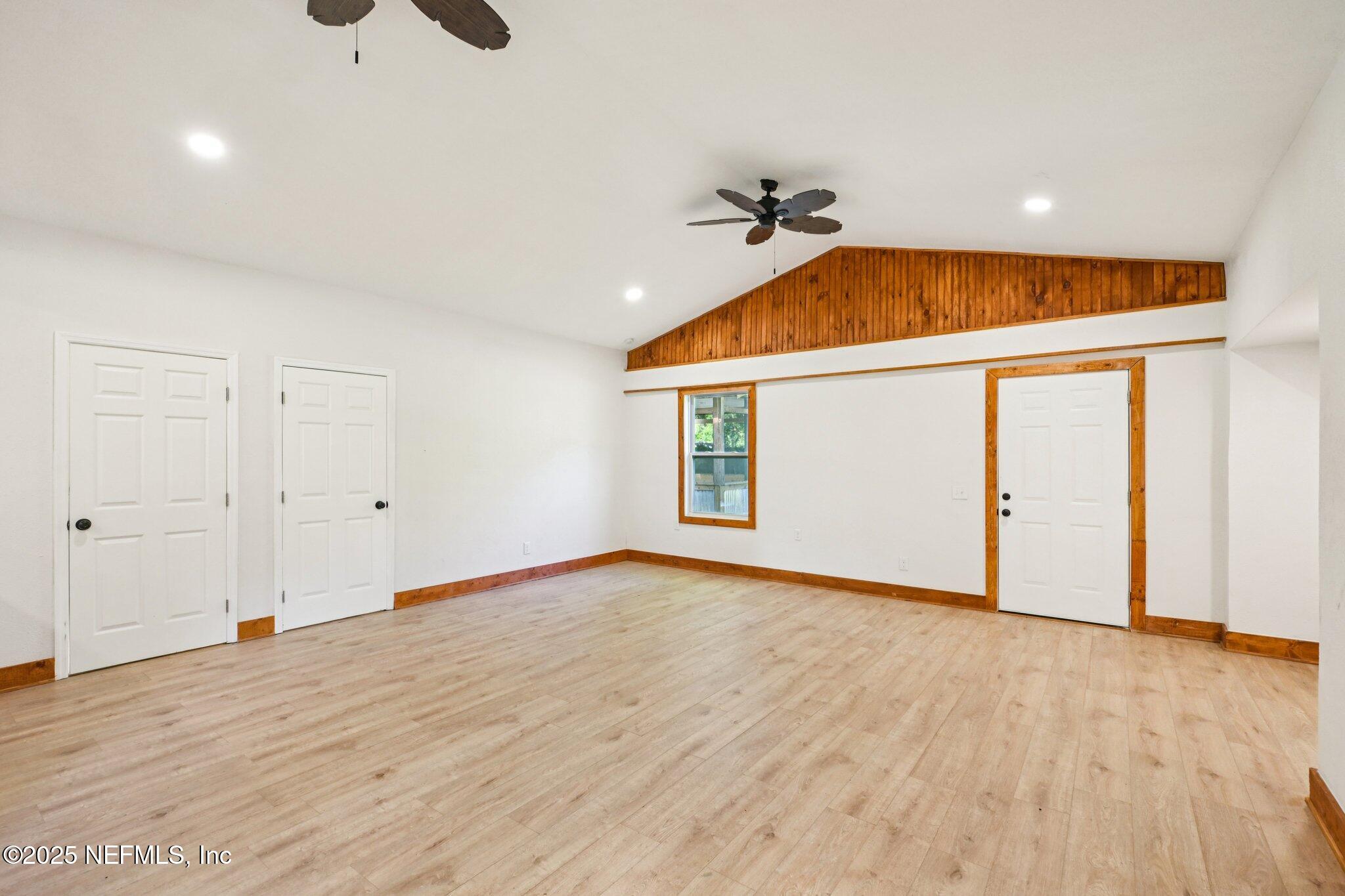 1217 Colley Road Starke, FL 32091 - Photo 9 of 42 wooden floor in an empty room with a window