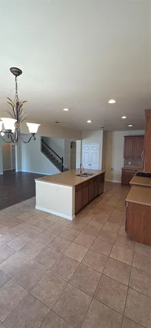 a view of kitchen with furniture and window